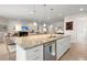 Open-concept kitchen island with granite countertop, sink, and pendant lighting at 423 Four Seasons Blvd, Summerville, SC 29486