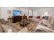 Relaxing living room with plush seating and a large television at 423 Four Seasons Blvd, Summerville, SC 29486