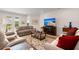 Comfortable living room with plush seating and a large screen television at 423 Four Seasons Blvd, Summerville, SC 29486