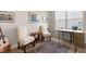 Bright office space with two chairs, desk, window and hardwood floors at 423 Four Seasons Blvd, Summerville, SC 29486