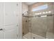 Modern tiled shower with glass door, corner seat, and stylish fixtures in a well-lit bathroom at 423 Four Seasons Blvd, Summerville, SC 29486