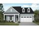 Charming one-story home with blue siding, black roof, white trim, a covered entry, and an attached two-car garage at 428 Evening Glow Ln, Summerville, SC 29486