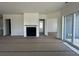 Bright living room with shiplap fireplace, and slider door to back porch at 428 Evening Glow Ln, Summerville, SC 29486