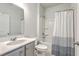 Clean bathroom featuring modern fixtures, a vanity, and a shower-tub combination with a stylish shower curtain at 431 Canal Crossing Way, Huger, SC 29450
