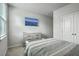 Bright bedroom with a window, TV and a comfortable bed, creating a welcoming and functional living space at 431 Canal Crossing Way, Huger, SC 29450