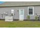 Exterior view of home featuring generator, water heater and gray siding at 431 Canal Crossing Way, Huger, SC 29450