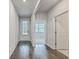 Bright hallway with hardwood floors leads to various rooms in the home at 431 Canal Crossing Way, Huger, SC 29450