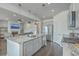 Bright kitchen features stainless steel appliances, granite countertops, and a large central island at 431 Canal Crossing Way, Huger, SC 29450
