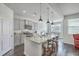 Modern kitchen with granite countertops, stainless steel appliances, and island seating at 431 Canal Crossing Way, Huger, SC 29450