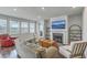 Cozy living room features fireplace, dark wood floors, and ample natural light at 431 Canal Crossing Way, Huger, SC 29450