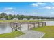 Picturesque pond is complemented by a wooden pier, adding a touch of serenity to the community at 431 Canal Crossing Way, Huger, SC 29450