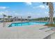 Sparkling pool with a large open-air pavilion and surrounding lounging furniture offers a relaxing oasis at 431 Canal Crossing Way, Huger, SC 29450