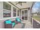 Enjoy this screened porch with ceiling fan, plush seating and view of the backyard at 431 Canal Crossing Way, Huger, SC 29450