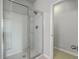 This bathroom features a glass enclosed shower with a chrome shower head, and built-in shelving at 431 Canal Crossing Way, Huger, SC 29450