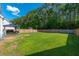 Large backyard with a wooden fence, green grass, and a gazebo at 435 Foxbank Plantation Blvd Blvd, Moncks Corner, SC 29461