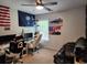 Bedroom with computer setup, flags, and helicopter art, and a window with natural light at 435 Foxbank Plantation Blvd Blvd, Moncks Corner, SC 29461