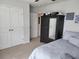 Cozy bedroom with a dresser, double door closet, and neutral decor at 435 Foxbank Plantation Blvd Blvd, Moncks Corner, SC 29461