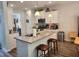 Modern kitchen with granite countertops, stainless appliances, and a breakfast bar with seating at 435 Foxbank Plantation Blvd Blvd, Moncks Corner, SC 29461