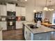 Modern kitchen with granite countertops, stainless appliances, and hardwood floors at 435 Foxbank Plantation Blvd Blvd, Moncks Corner, SC 29461