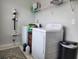 Laundry room with white washer and dryer and wire shelf, and hardwood patterned floors at 435 Foxbank Plantation Blvd Blvd, Moncks Corner, SC 29461