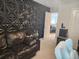 Modern living room featuring a stylish accent wall, a comfortable couch, and unique decor at 435 Foxbank Plantation Blvd Blvd, Moncks Corner, SC 29461