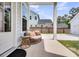 Cozy back porch with wicker seating and a small table, ideal for enjoying the outdoor scenery at 435 Woodgate Way, Summerville, SC 29485
