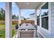 Comfortable back porch with outdoor dining set, perfect for entertaining or relaxing at 435 Woodgate Way, Summerville, SC 29485