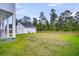 Spacious backyard with a detached garage and a privacy fence at 435 Woodgate Way, Summerville, SC 29485