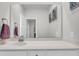 Bright bathroom featuring a large mirror, modern vanity, and decorative wall art at 435 Woodgate Way, Summerville, SC 29485