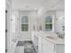 Bathroom with a glass-enclosed shower and double vanity sinks with bright lighting at 435 Woodgate Way, Summerville, SC 29485