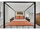Bedroom featuring a bed with black frame, cozy linens, and a view from the window at 435 Woodgate Way, Summerville, SC 29485