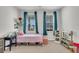 Cozy bedroom with a bed, colorful decor, and a sunny window view at 435 Woodgate Way, Summerville, SC 29485