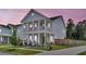Beautiful two-story home with a covered porch, captured at dusk at 435 Woodgate Way, Summerville, SC 29485