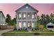 Charming two-story home featuring a double porch and meticulously landscaped yard at 435 Woodgate Way, Summerville, SC 29485