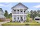 Charming two-story home with double porches and meticulous landscaping at 435 Woodgate Way, Summerville, SC 29485