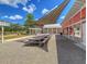 A charming outdoor seating area with picnic tables, providing a perfect spot for gatherings at 435 Woodgate Way, Summerville, SC 29485