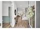 Elegant foyer showcasing hardwood floors, stylish decor, and a staircase leading to the upper level at 435 Woodgate Way, Summerville, SC 29485