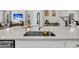 New kitchen has a stainless steel sink with modern faucet and light countertops at 435 Woodgate Way, Summerville, SC 29485