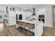 Spacious kitchen features a large center island with bar seating and stainless steel appliances at 435 Woodgate Way, Summerville, SC 29485