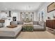 Open living space featuring a gray sectional, natural light, and a view into the modern kitchen at 435 Woodgate Way, Summerville, SC 29485
