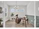 Stylish home office featuring a modern desk, elegant lighting, and ample natural light from multiple windows at 435 Woodgate Way, Summerville, SC 29485