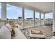 Inviting outdoor porch with seating, a rug, and neighborhood views from the covered area at 435 Woodgate Way, Summerville, SC 29485