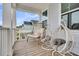 Relaxing porch with egg chairs offering neighborhood views and comfortable lounging at 435 Woodgate Way, Summerville, SC 29485