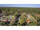Aerial view of a property with mature trees and neighboring homes, highlighting its serene and private setting at 4401 Prices Bridge Ln, Walterboro, SC 29488