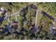 Aerial view of a sprawling community with a mix of homes, RVs, and wooded areas, showcasing its unique layout at 4401 Prices Bridge Ln, Walterboro, SC 29488