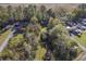 Aerial shot of a property featuring a cozy house nestled amongst mature trees near a stream at 4401 Prices Bridge Ln, Walterboro, SC 29488