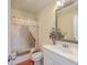 Bathroom with white vanity, framed mirror, decorative vase, bathtub, and shower at 4401 Prices Bridge Ln, Walterboro, SC 29488