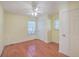 Bedroom features hardwood floors, ceiling fan, natural lighting, and neutral paint at 4401 Prices Bridge Ln, Walterboro, SC 29488