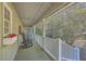 Relaxing covered porch with rocking chairs, offering a peaceful view of the surrounding nature at 4401 Prices Bridge Ln, Walterboro, SC 29488