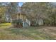 Charming home featuring a quaint porch, lush trees, and a well-manicured lawn at 4401 Prices Bridge Ln, Walterboro, SC 29488